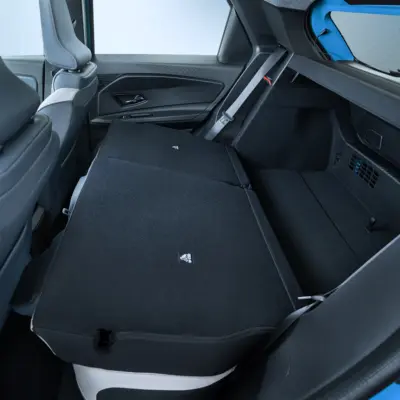 interior detail shot of collapsed rear seats revealing trunk space